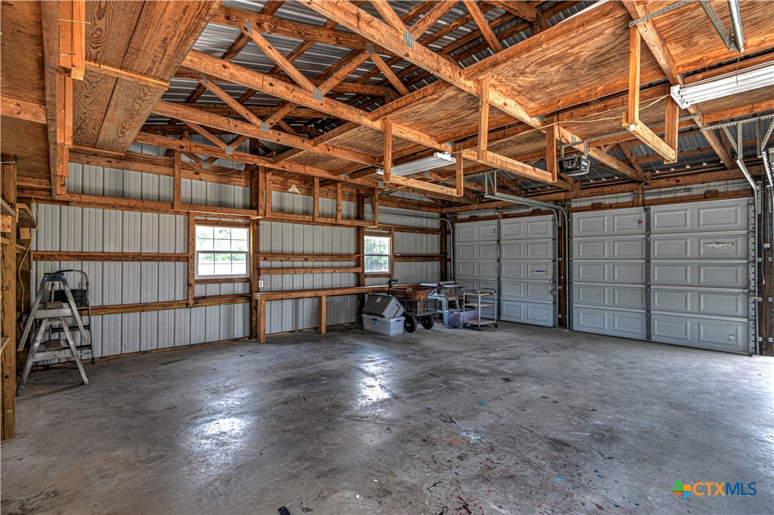 2810 FM 438 Loop Temple, TX 76501 - Photo 29 of 47 a view of a garage with wooden table and chairs