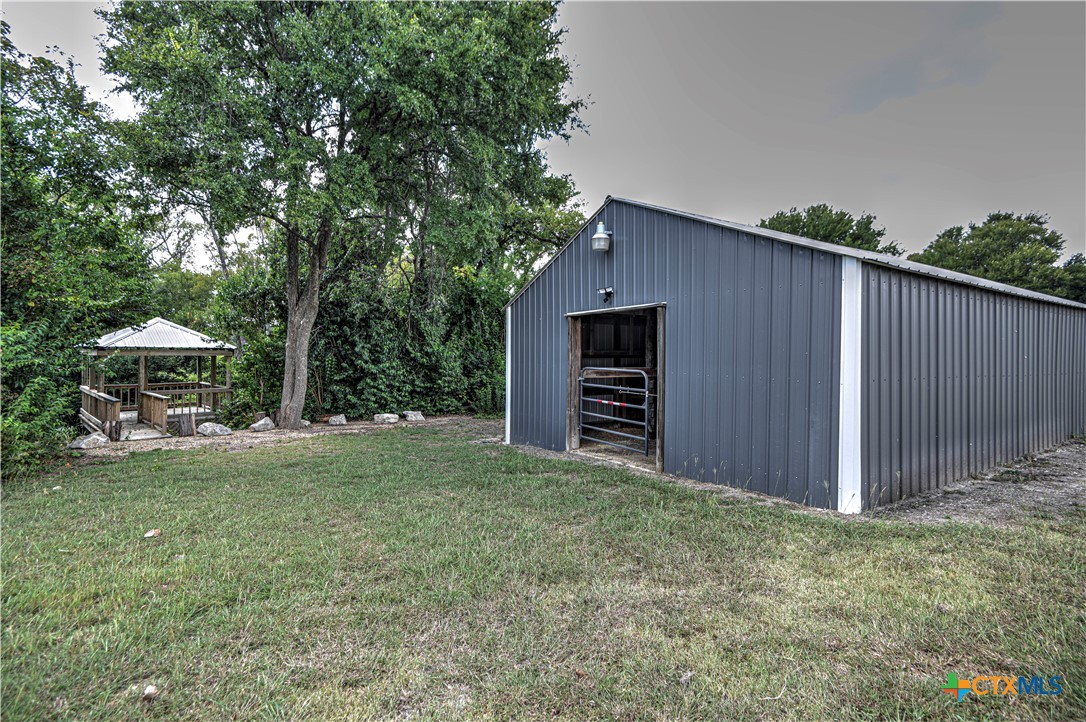 2810 FM 438 Loop Temple, TX 76501 - Photo 32 of 47 a view of a backyard with potted plants and large tree