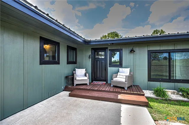 a kitchen with stainless steel appliances a sink stove and cabinets