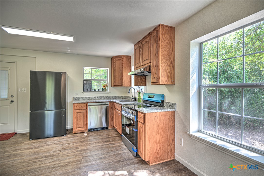 2810 FM 438 Loop Temple, TX 76501 - Photo 42 of 47 a kitchen with stainless steel appliances granite countertop a refrigerator and a sink