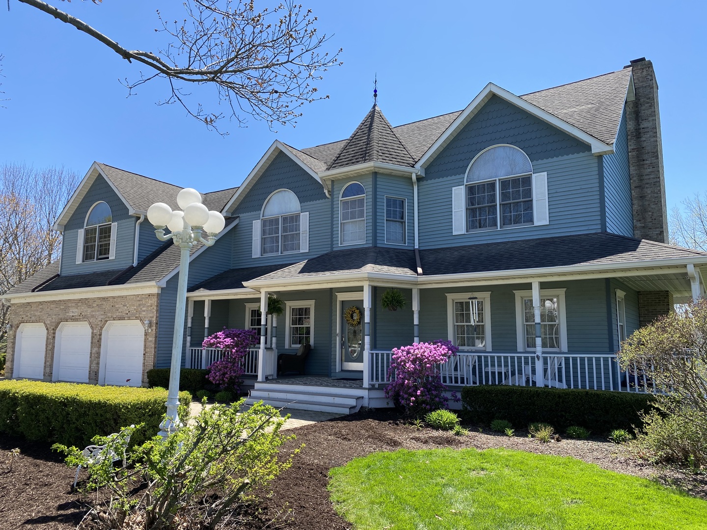 a front view of a house with garden
