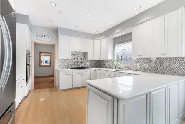 a kitchen with a sink cabinets and window