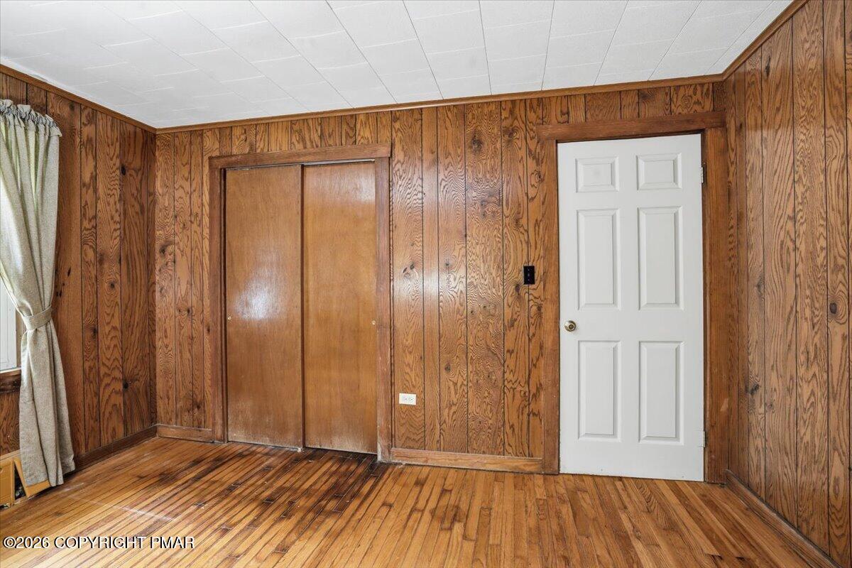 232 Garrity Road Hawley, PA 18428 - Photo 36 of 57 an empty room with wooden floor and windows