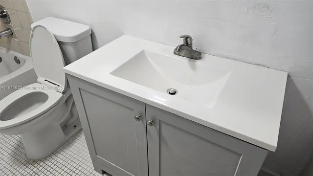 a bathroom with a sink and a toilet