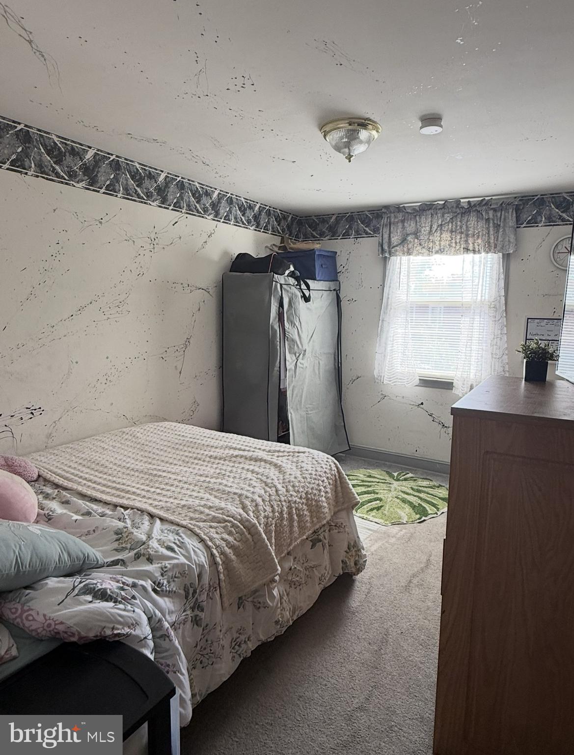 422 Rively Avenue Darby, PA 19023 - Photo 15 of 20 a bedroom with a bed and window