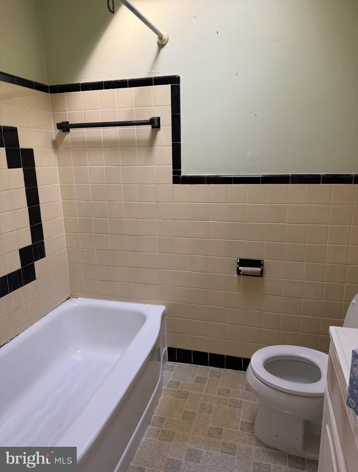 422 Rively Avenue Darby, PA 19023 - Photo 16 of 20 a bathroom with a granite countertop bathtub shower and toilet