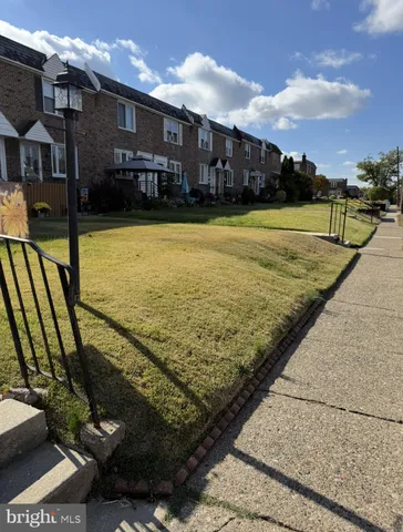 a view of a swimming pool with an outdoor seating