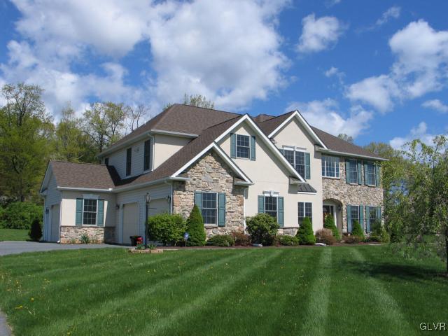 2128 Terry Road Nazareth, PA 18064 - Photo 2 of 15 a front view of a house with a garden