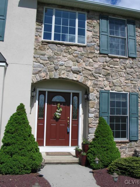 2128 Terry Road Nazareth, PA 18064 - Photo 3 of 15 front view of a brick house with large windows