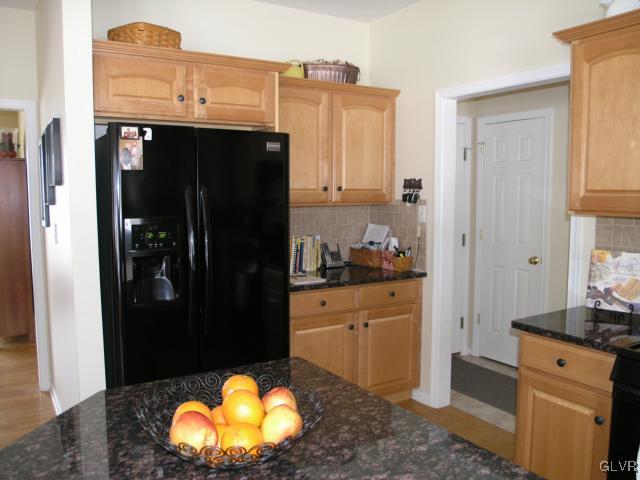2128 Terry Road Nazareth, PA 18064 - Photo 7 of 15 a kitchen with stainless steel appliances granite countertop a refrigerator and a stove
