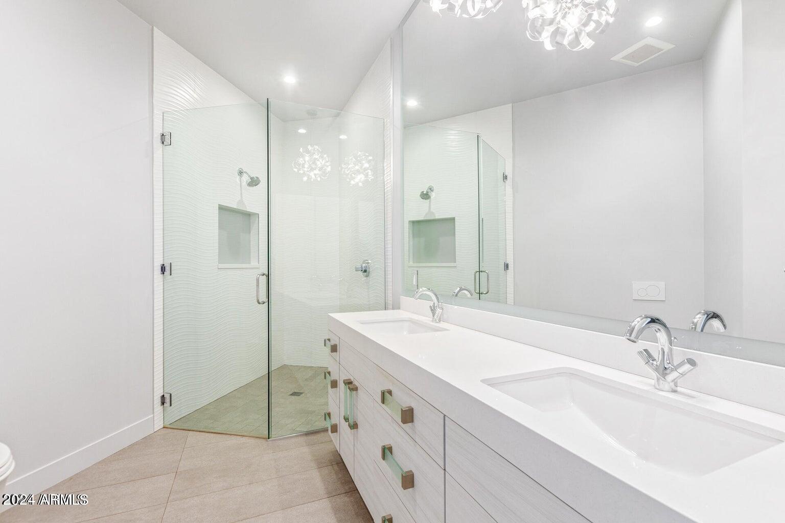 5833 North 46th Street Phoenix, AZ 85018 - Photo 20 of 29 a bathroom with double sink and a mirror