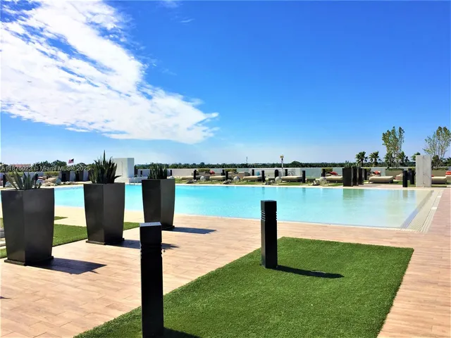 a view of a lake with a yard