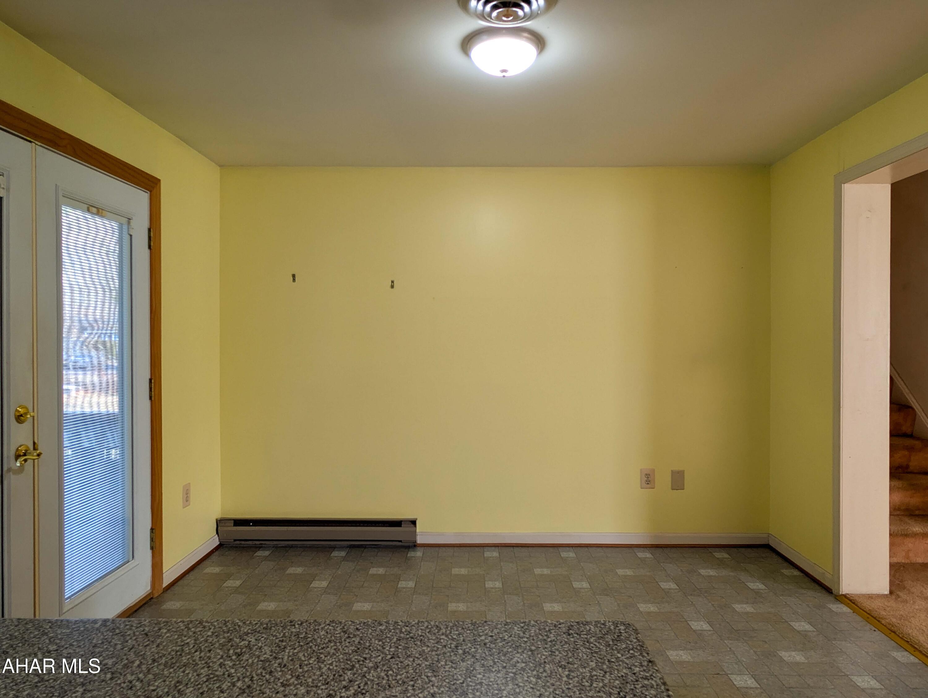 147 Pine Street Hyndman, PA 15545 - Photo 11 of 44 an empty room with a wooden door