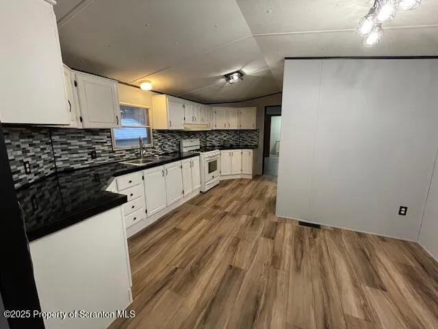a kitchen with sink and cabinets