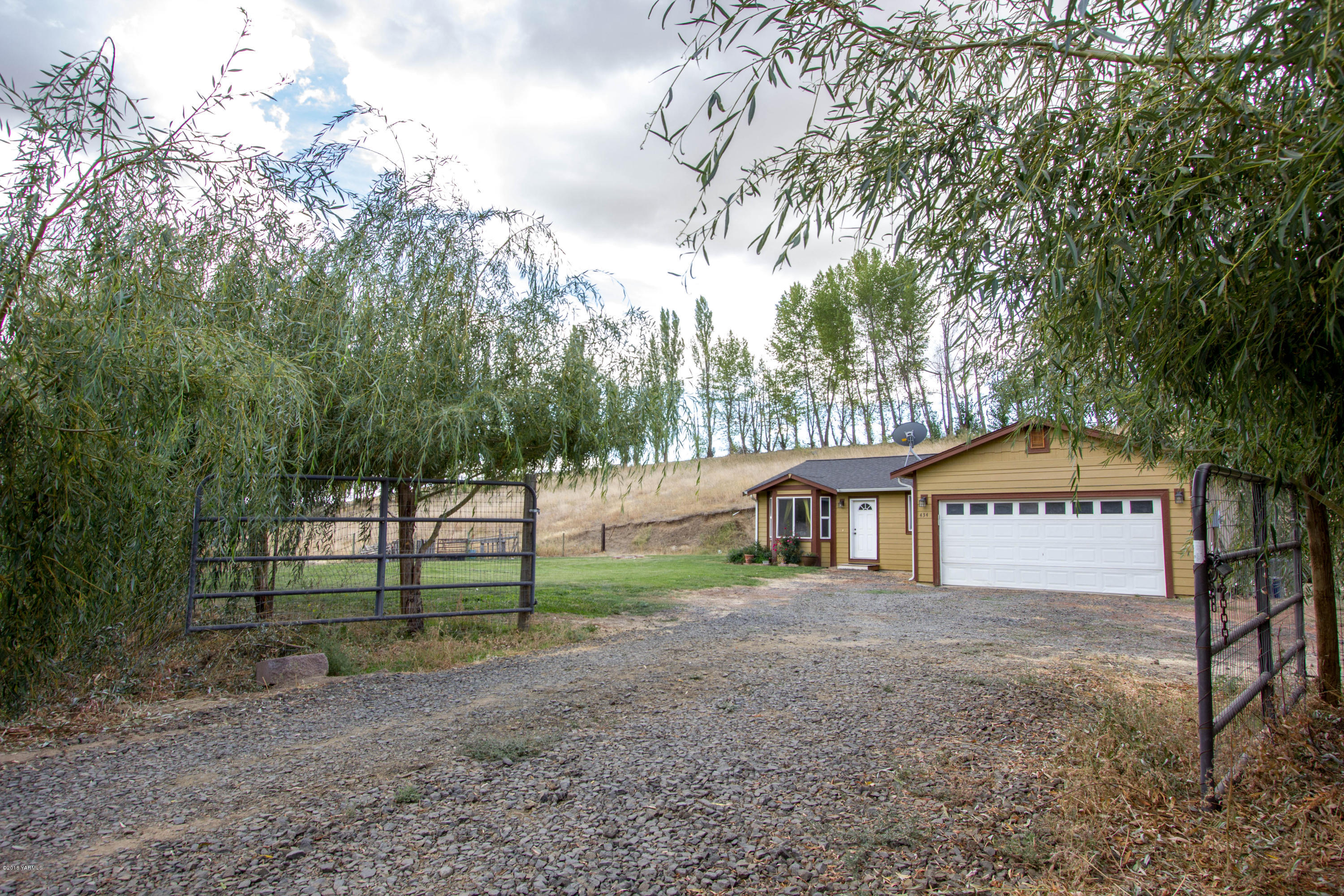 434 West Canyon Road Yakima, WA 98908 - Photo 7 of 23 a view of a house with large trees