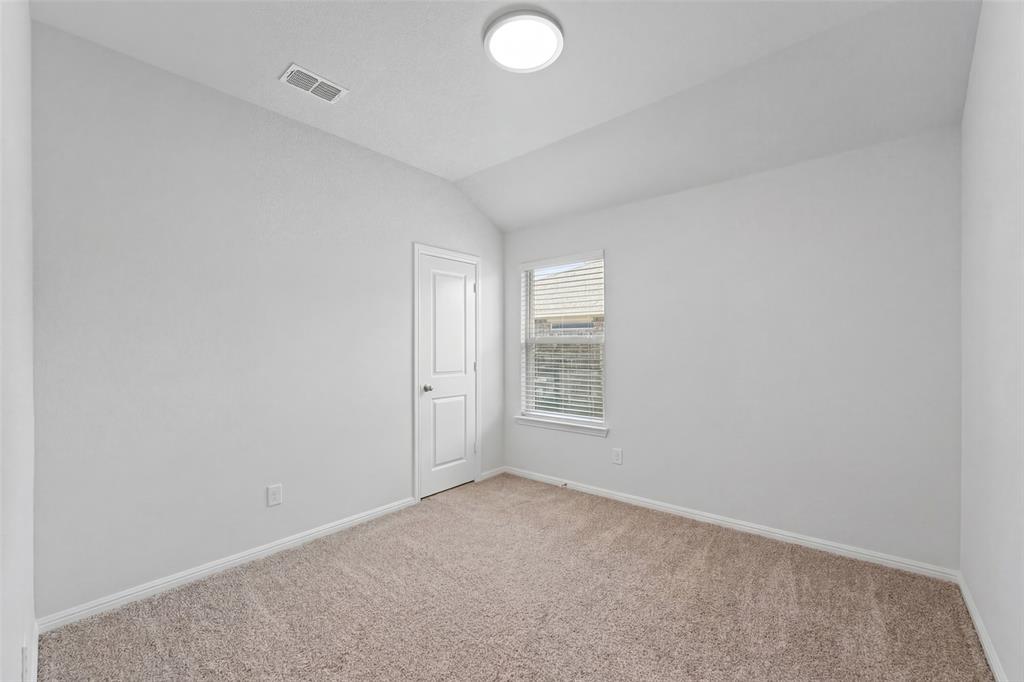 9020 Ridgeriver Way Fort Worth, TX 76131 - Photo 18 of 26 an empty room with windows