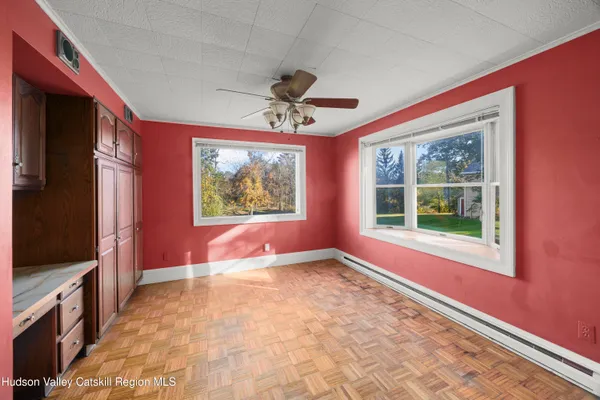 a view of an empty room with a window