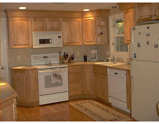 8 Still River Road Sterling, MA 01564 - Photo 3 of 6 a utility room with cabinets washer and dryer