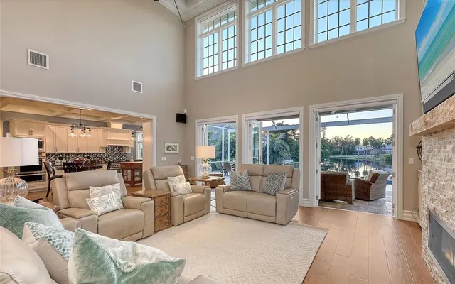 a view of a dining room with furniture wooden floor and chandelier