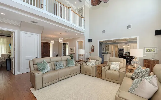 a kitchen with stainless steel appliances granite countertop a sink and a stove next to a window