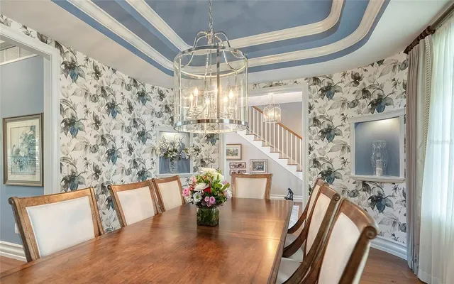 a kitchen with a table and chairs in it