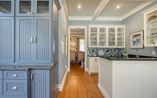 a kitchen with a sink and a large window