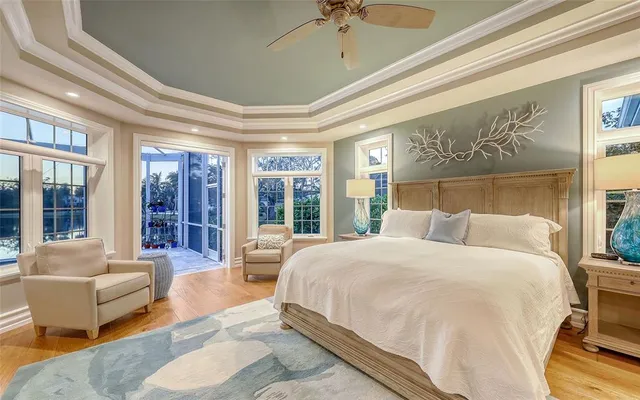 a room with a bed and a large window with outer view