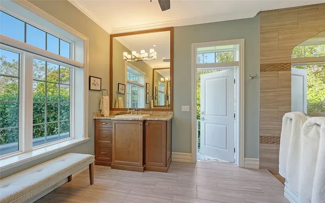 a bedroom with a bed couch and window