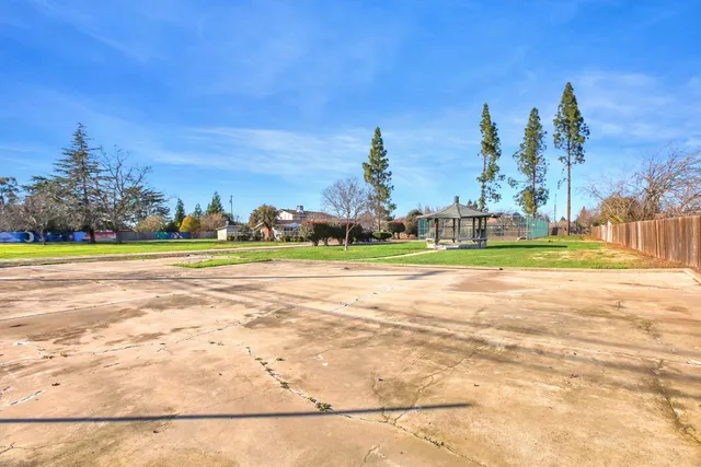 a view of a house with backyard porch and sitting area