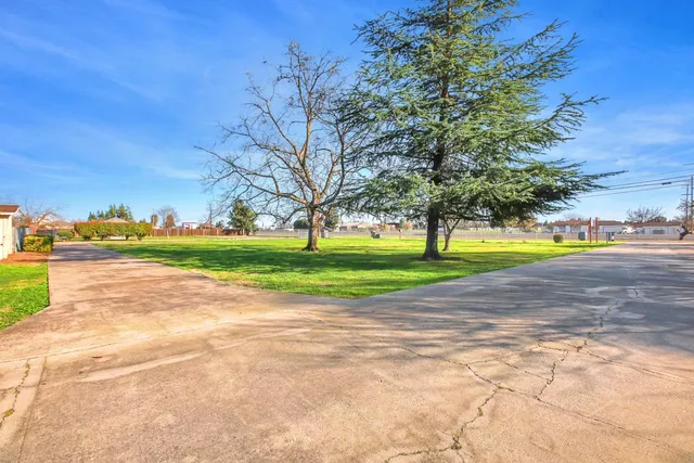 a view of a road with a building in the background