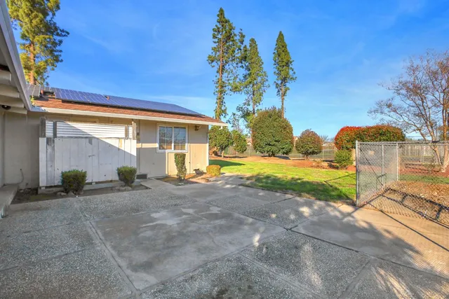 a view of a dining room with furniture and window