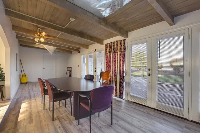 a view of a balcony with wooden floor and outdoor space