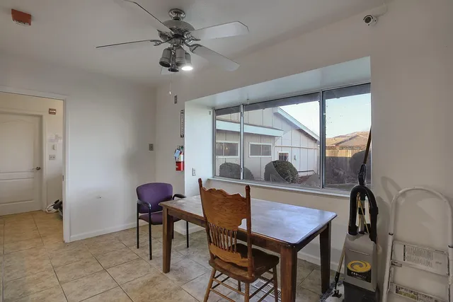 a view of a backyard with sitting area