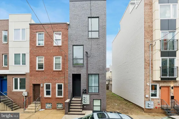 a front view of a building with large glass windows