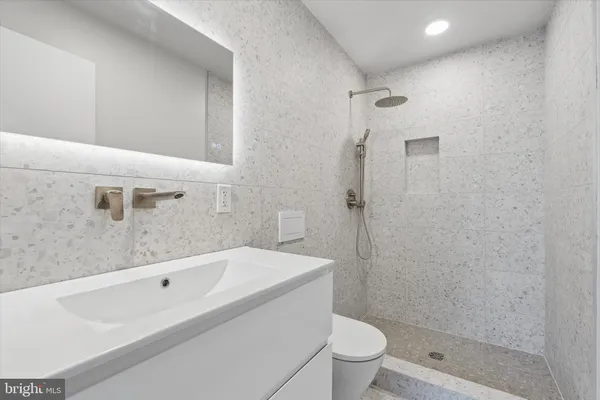 a bathroom with a bathtub and toilet
