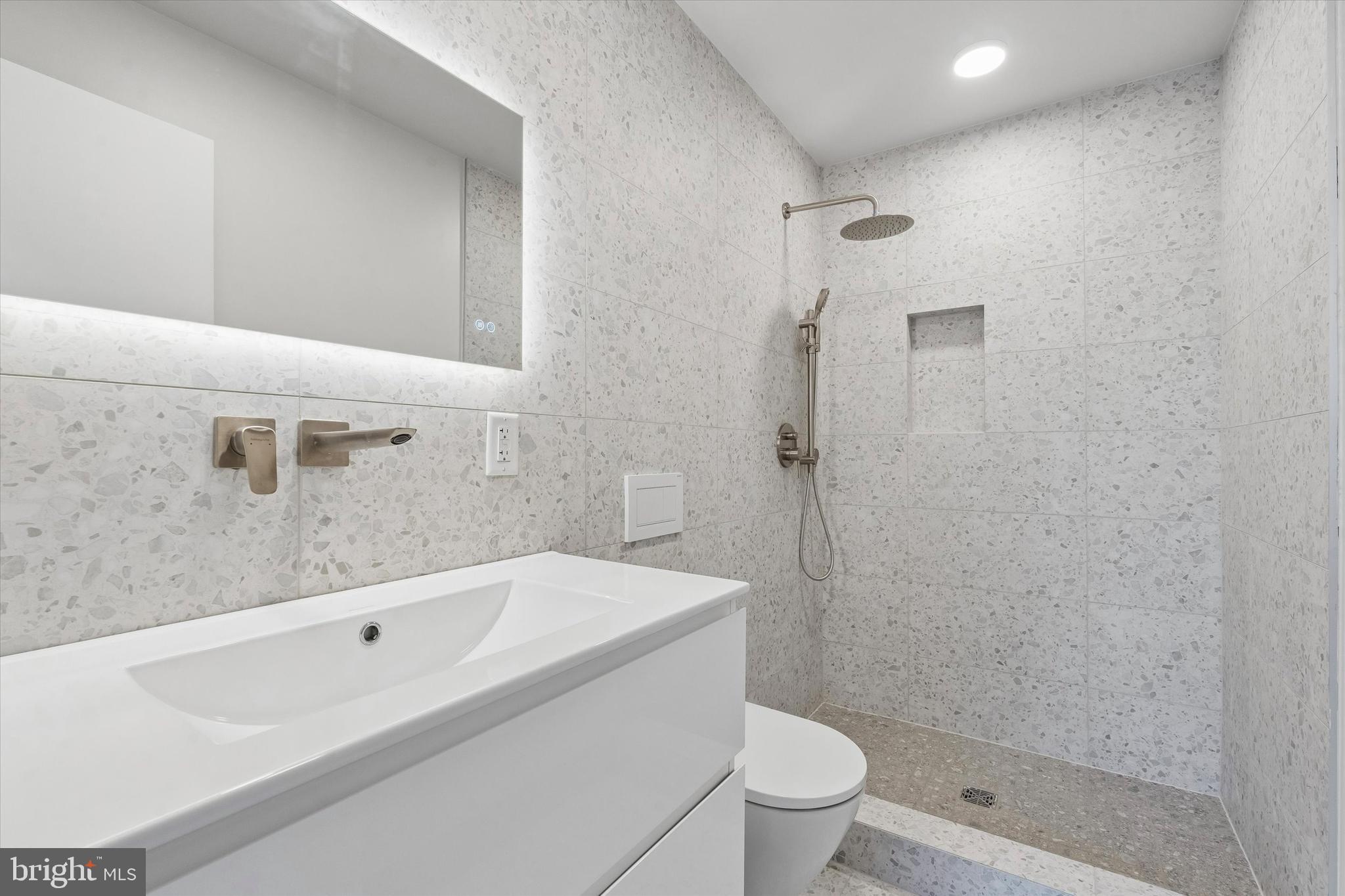 1911 North 9th Street, Unit 2 Philadelphia, PA 19122 - Photo 11 of 18 a bathroom with a bathtub and toilet