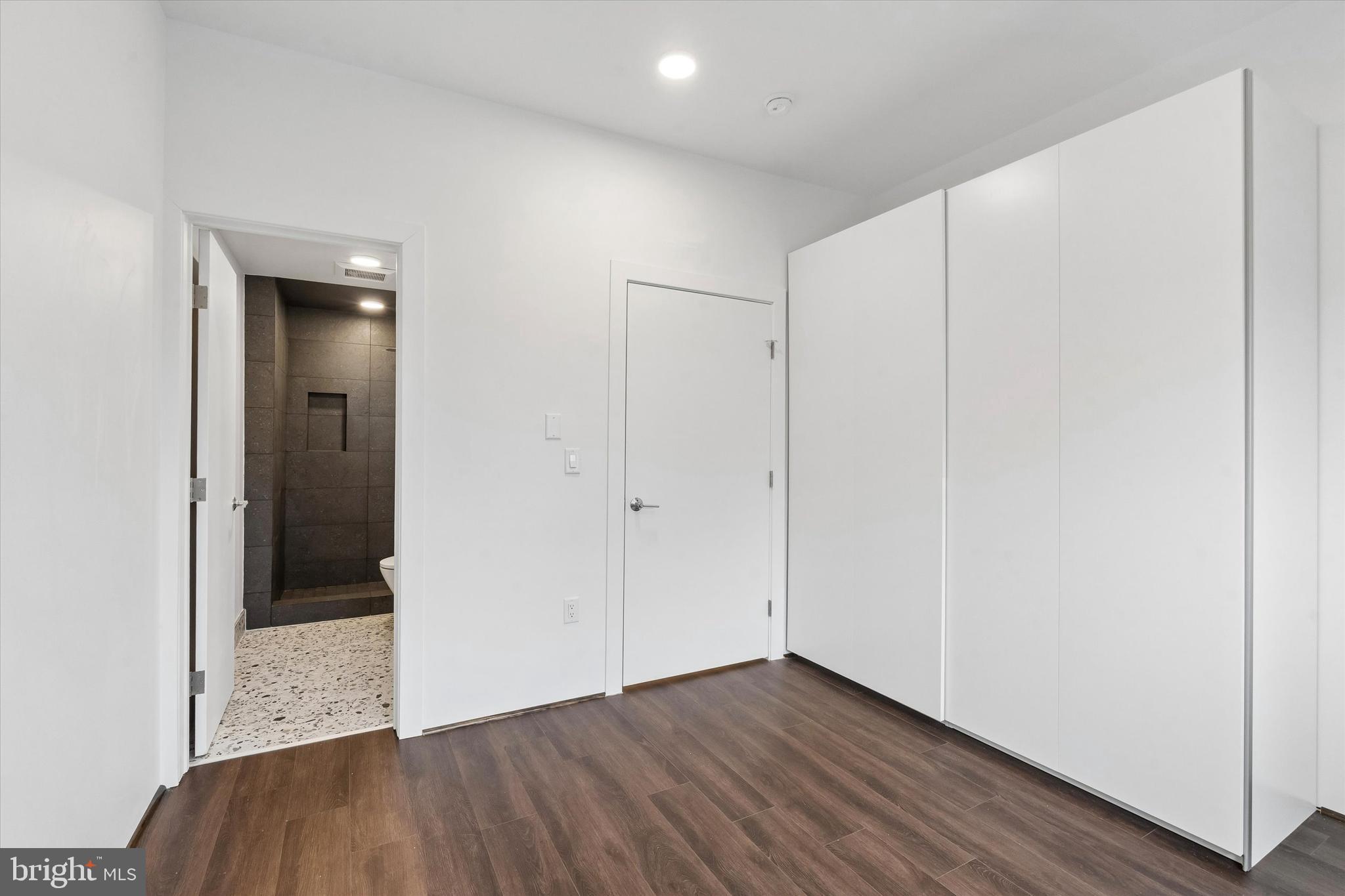 1911 North 9th Street, Unit 2 Philadelphia, PA 19122 - Photo 10 of 18 an empty room with wooden floor