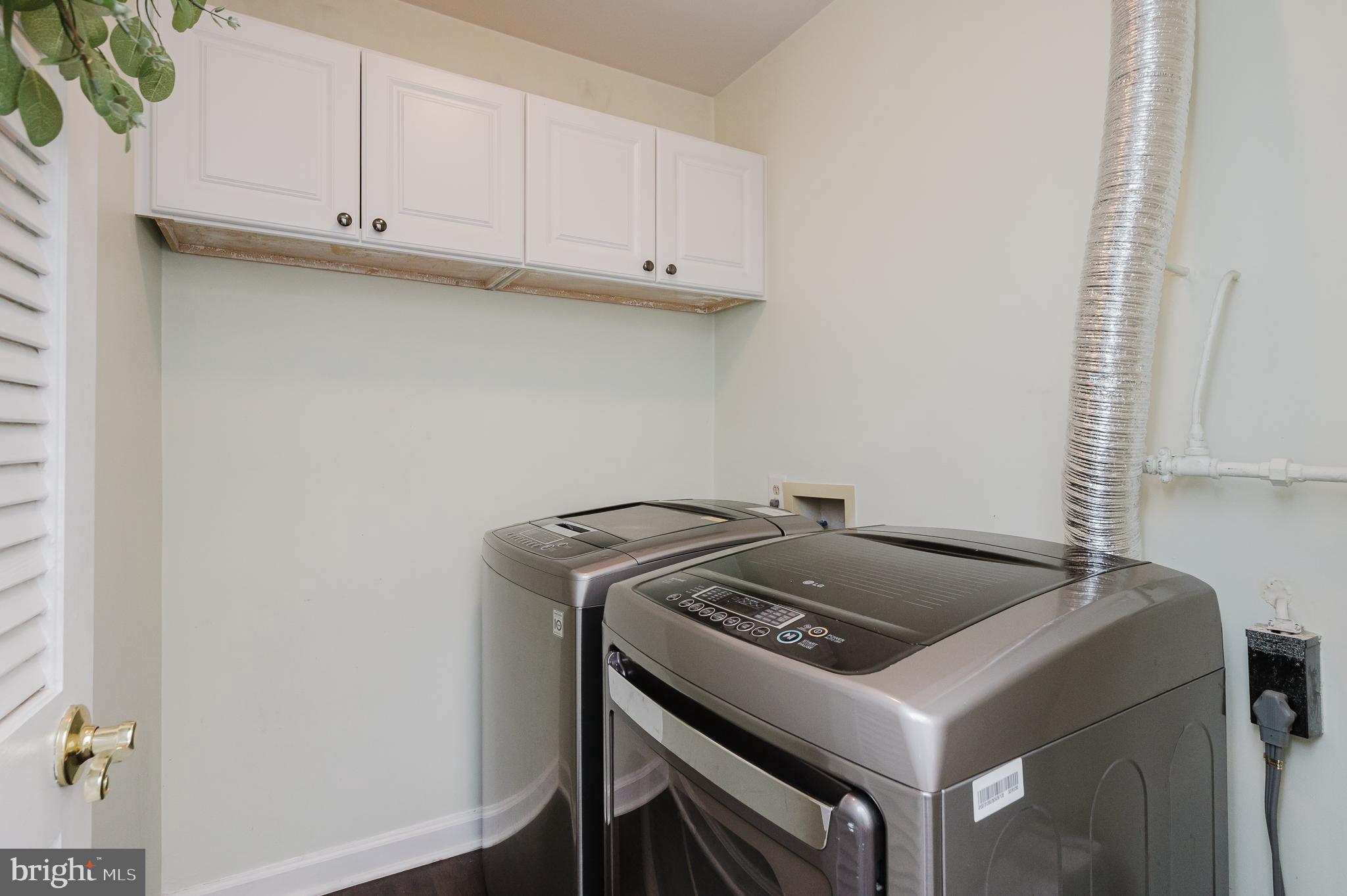 6830 H Hayley Ridge Way, Unit H Baltimore, MD 21209 - Photo 16 of 43 with cabinet storage and LG Washer & Dryer