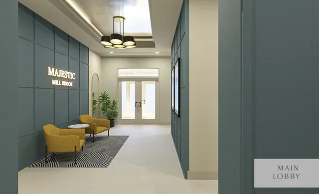 a living room with furniture and a book shelf