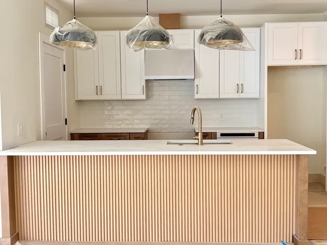 a kitchen with a stove a sink and dishwasher