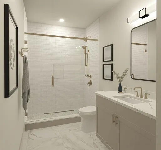 a bathroom with a sink a toilet and shower