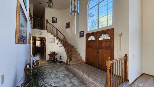 a kitchen with a sink window and cabinets