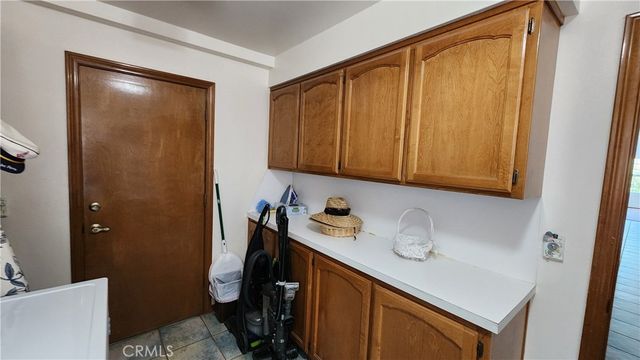 a view of a livingroom with workspace and a window