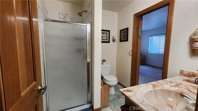 a bedroom with a bed and a closet