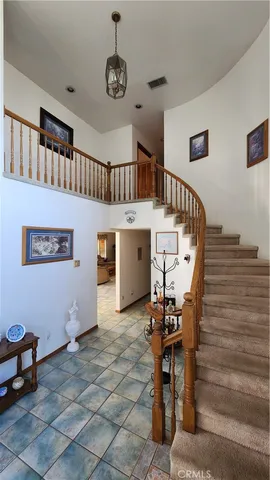 a bedroom with a bed and a mirror