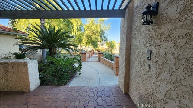 a swimming pool with outdoor seating and yard