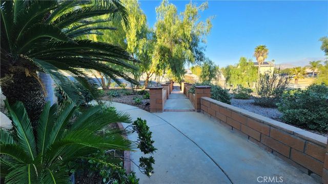 a swimming pool with outdoor seating yard and barbeque oven