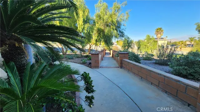 a swimming pool with outdoor seating yard and barbeque oven