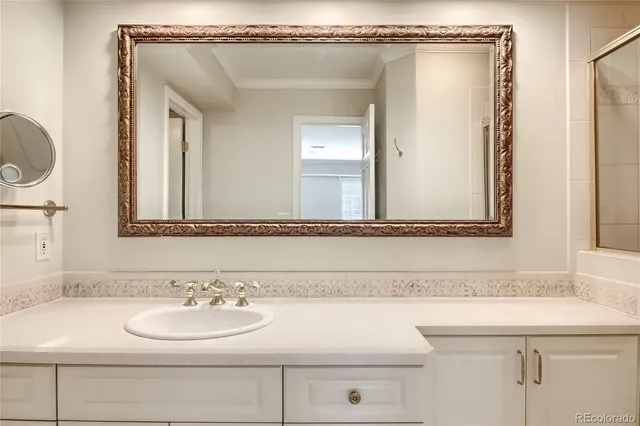 an empty room with closet and a bathroom