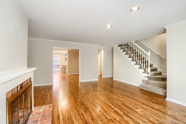 a kitchen with stainless steel appliances a stove refrigerator and cabinets
